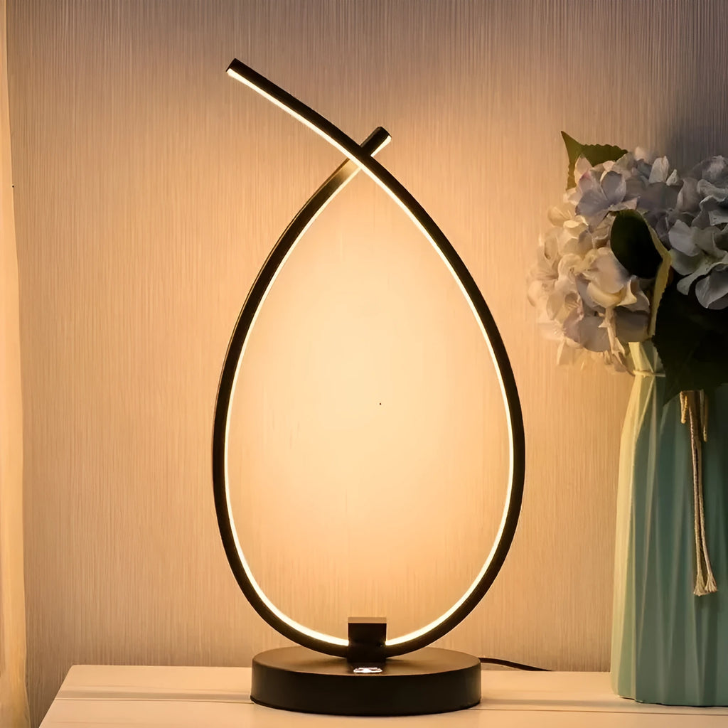 Black and white drop-shaped USB bedside table lamp with touch or switch control.