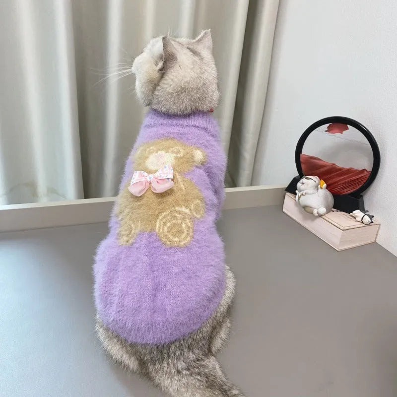 Wool pet sweater with bow tie and bear design in purple, pink, green-blue, or white, sizes XS to XXL.