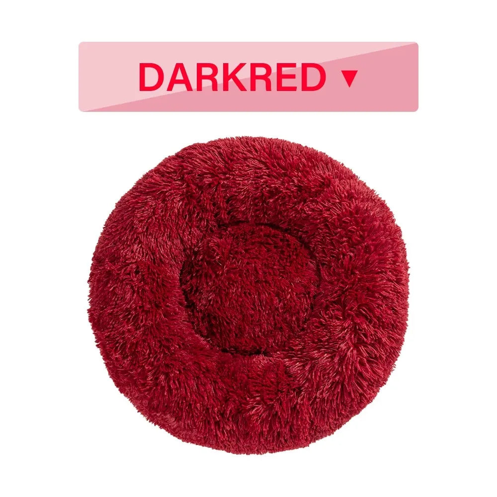 Fluffy donut-shaped pet bed in long plush fabric, shown in a grey colour