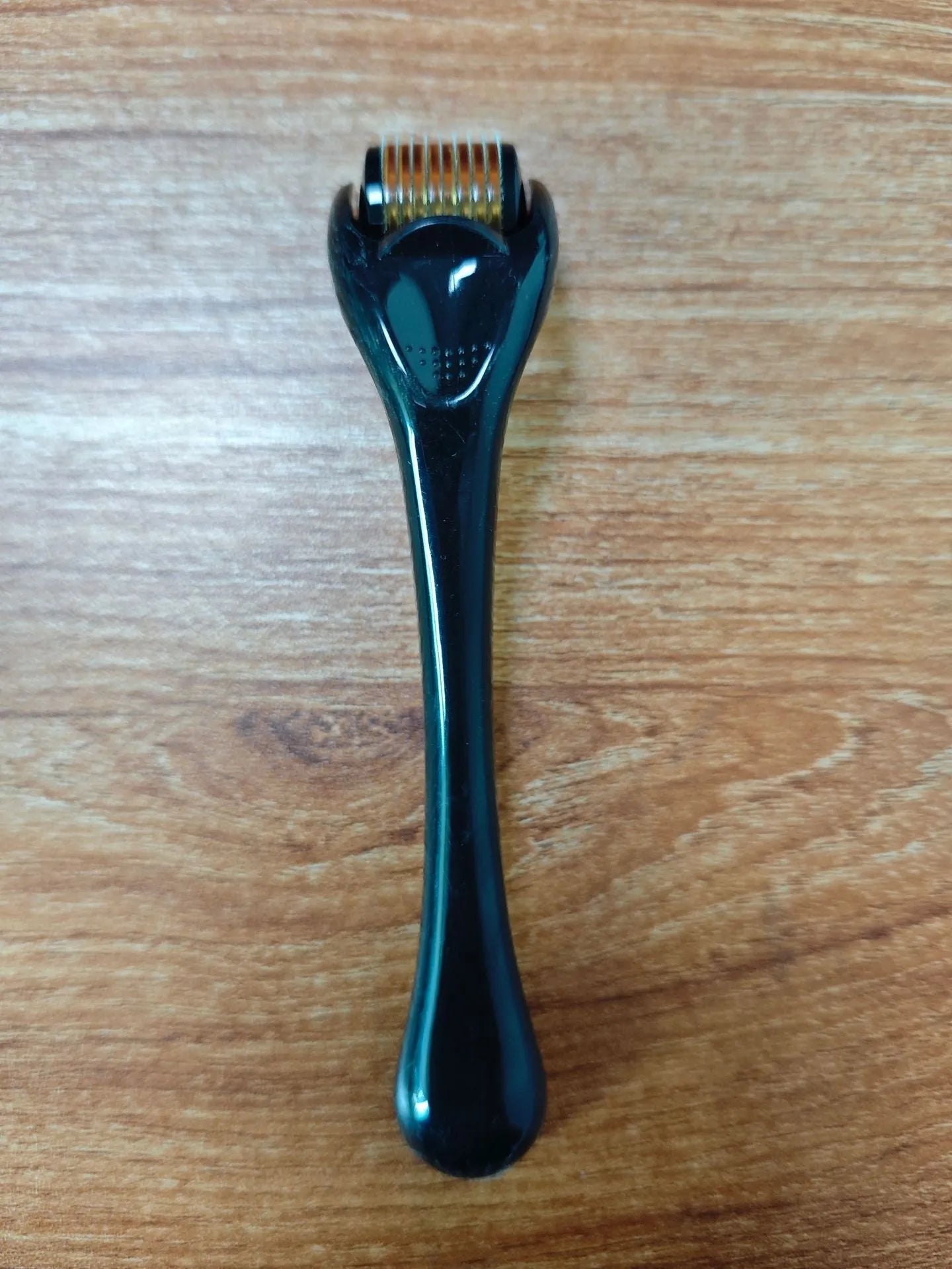 540 Micro Needle Roller device with mechanical font size display showing needle specification