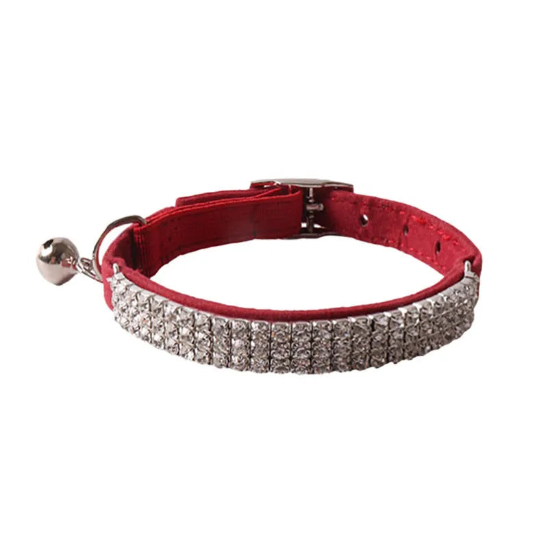 Soft flocking elastic buckle cat collar in multiple colours on a white background.