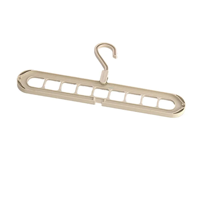 Multifunctional nine-hole plastic hanger for trousers and skirts in five colour options on a white background.