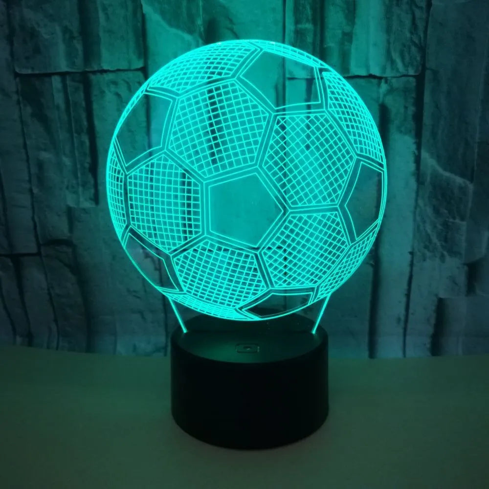 3D football shaped LED night light showing multiple colour options on a dark surface.