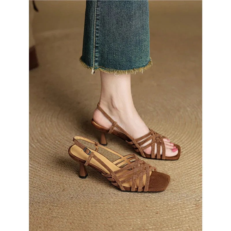 Retro soft leather women's high heel sandals with thin cross straps and an ankle buckle in light brown.