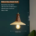 Retro wooden ceiling lamp with brass details and glass shade shown in a dining setting