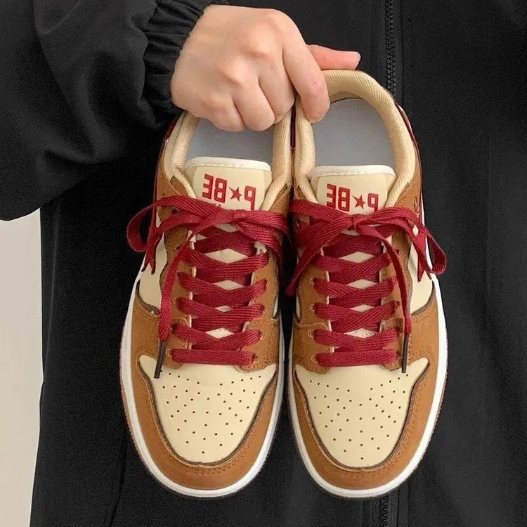 Brown women's low-top platform sneakers with sequin details, round toe, and front lace-up fastening.