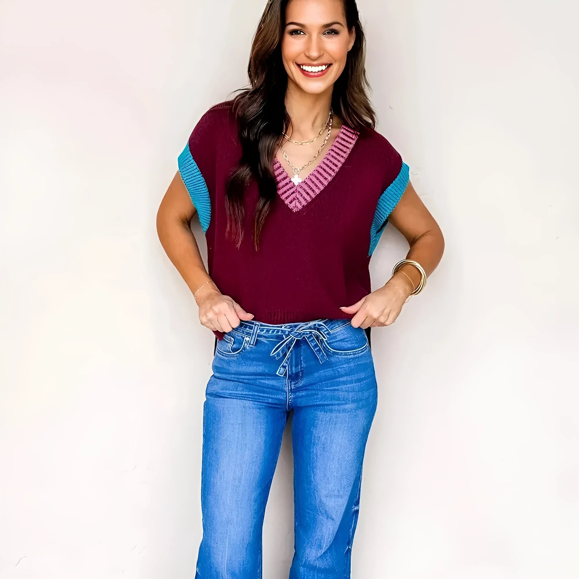 Burgundy loose knit V-neck sweater with contrast trim and cuffed short sleeves