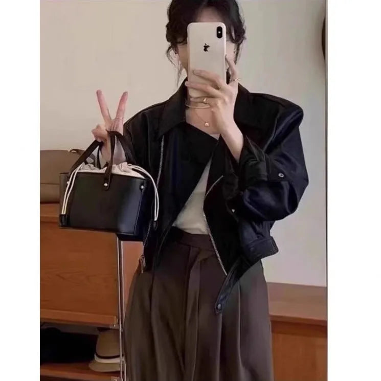 Women's brown retro slim fit imitation leather coat with long sleeves and pockets.