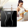 Black electronic body scale with digital display showing weight measurement up to 180KG