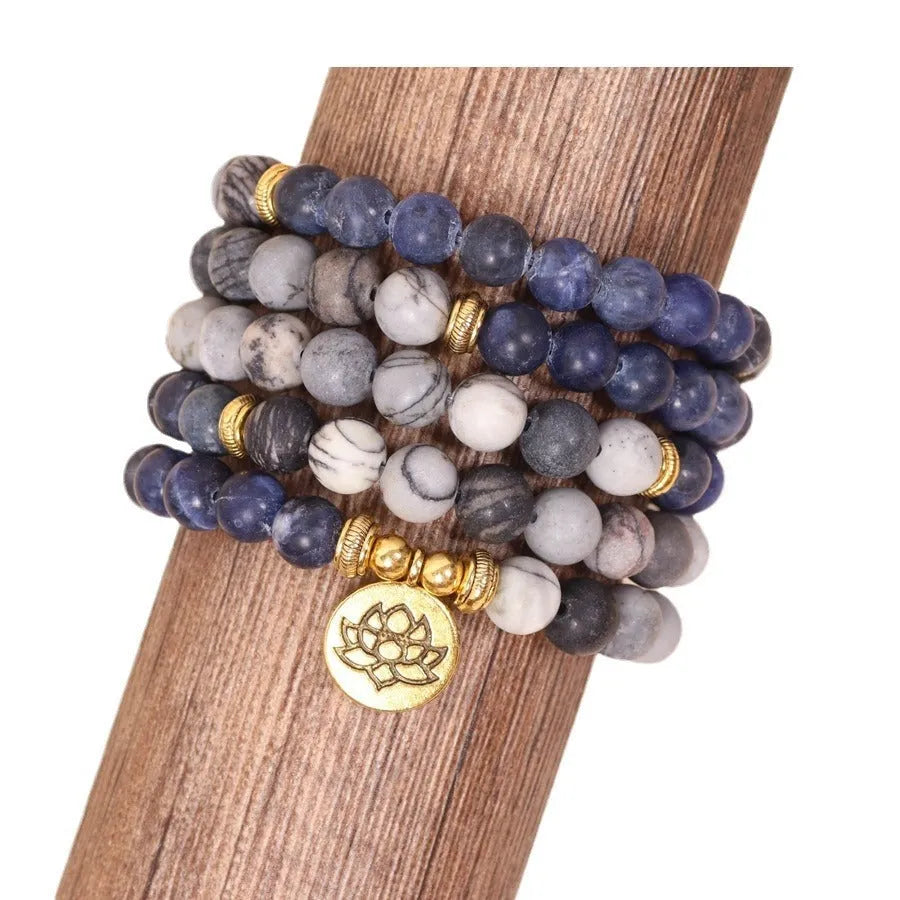 Blue multi layer bracelet with patterned network stone beads and alloy construction