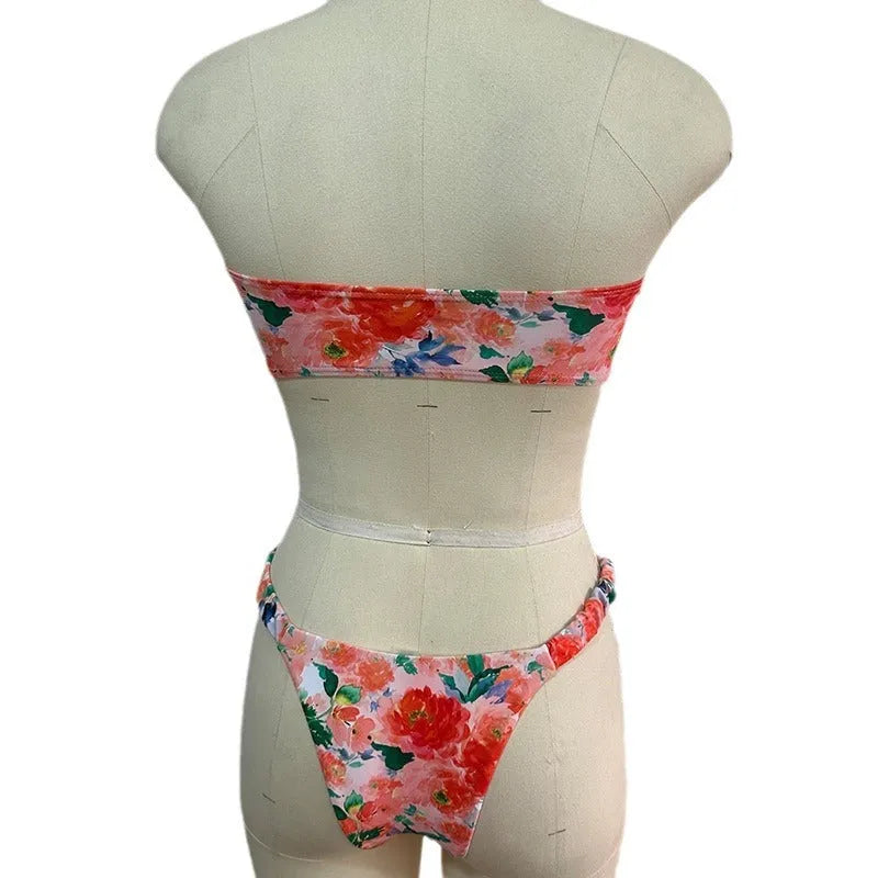 Floral print blue bikini tube top with lace trim and backless design for swimming.
