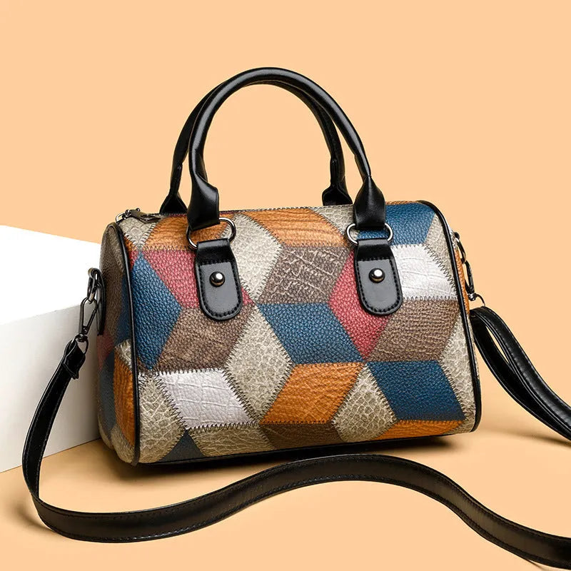 Cylinder crossbody shoulder bag in black or brown PU with plaid geometric pattern and single strap