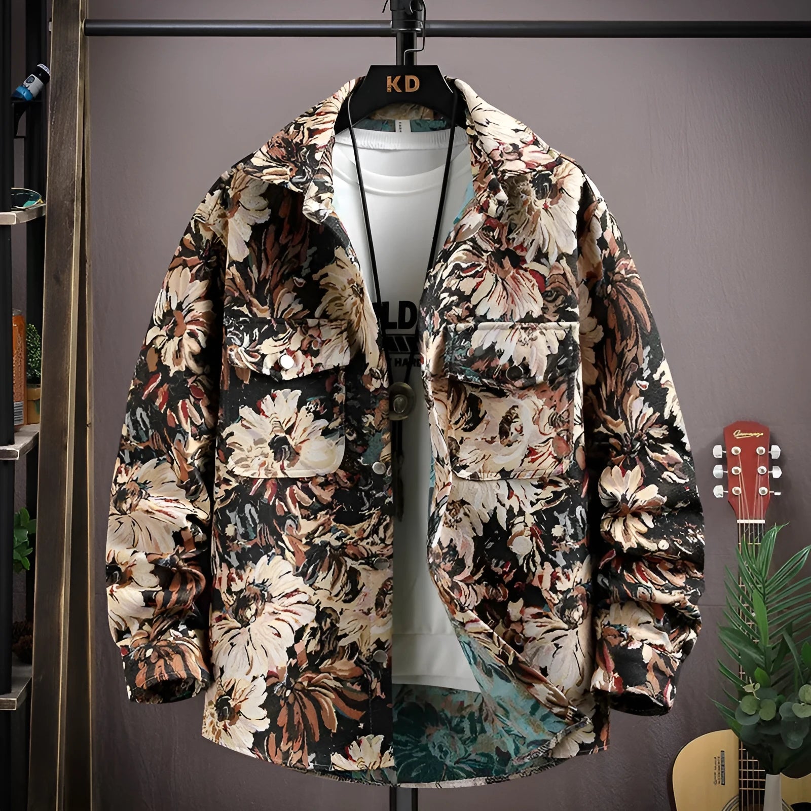 Casual lapel shirt coat in a light colour with long sleeves and straight hem, shown on a hanger.