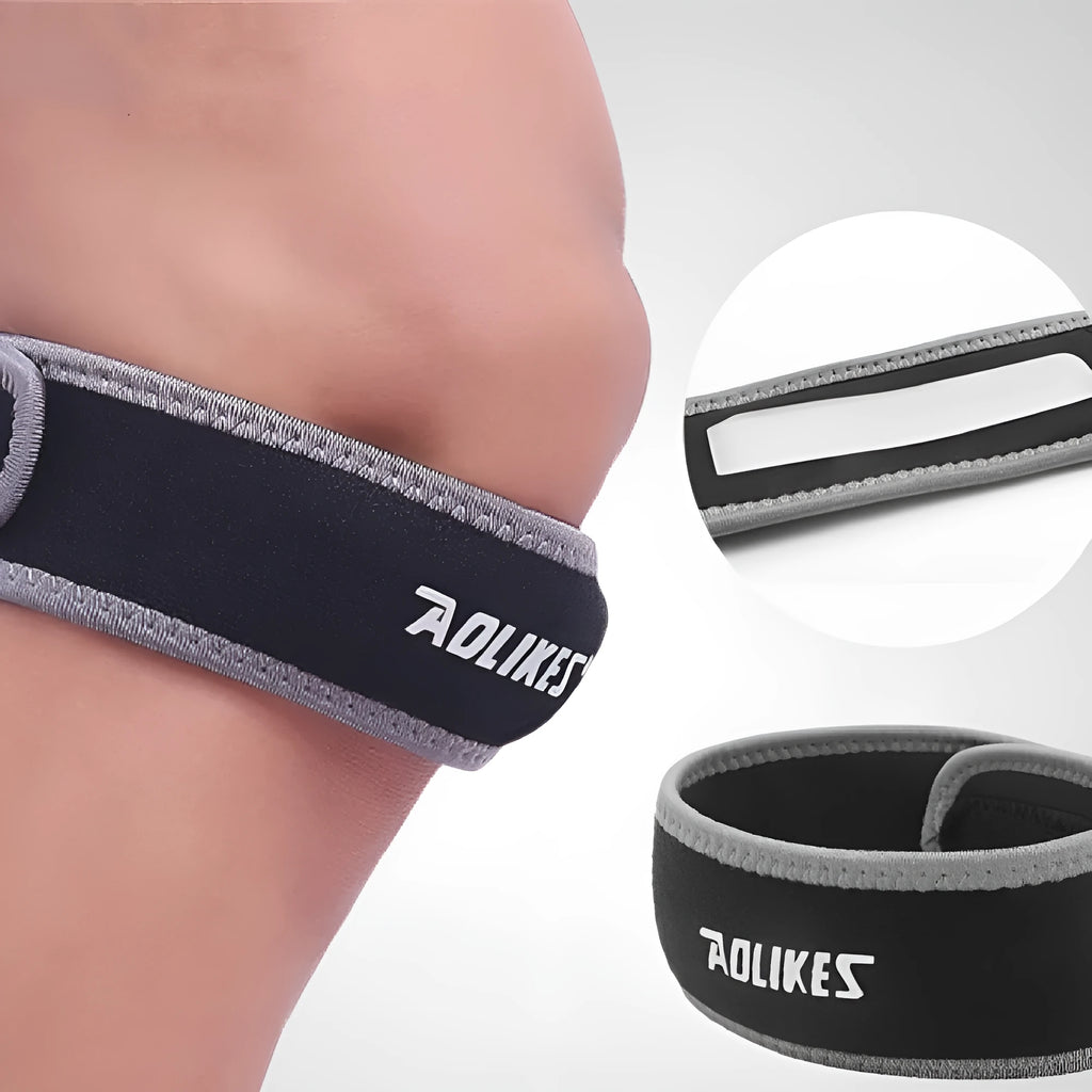 Black and grey patella retinaculum knee support for sports, showing wrap-around design.