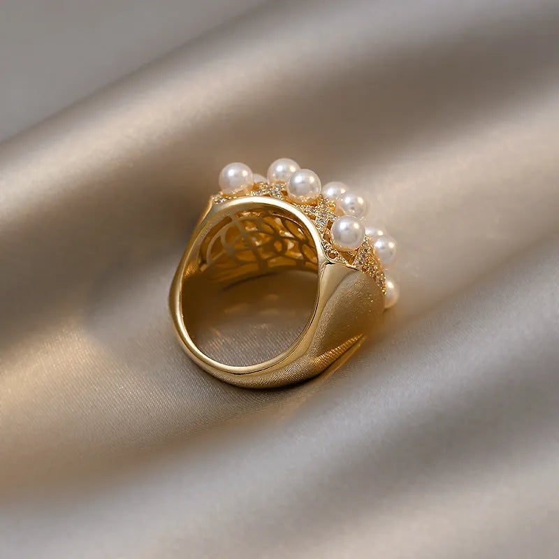 Copper zircon pearl geometric ring with 14K gold electroplated finish and adjustable opening for women.
