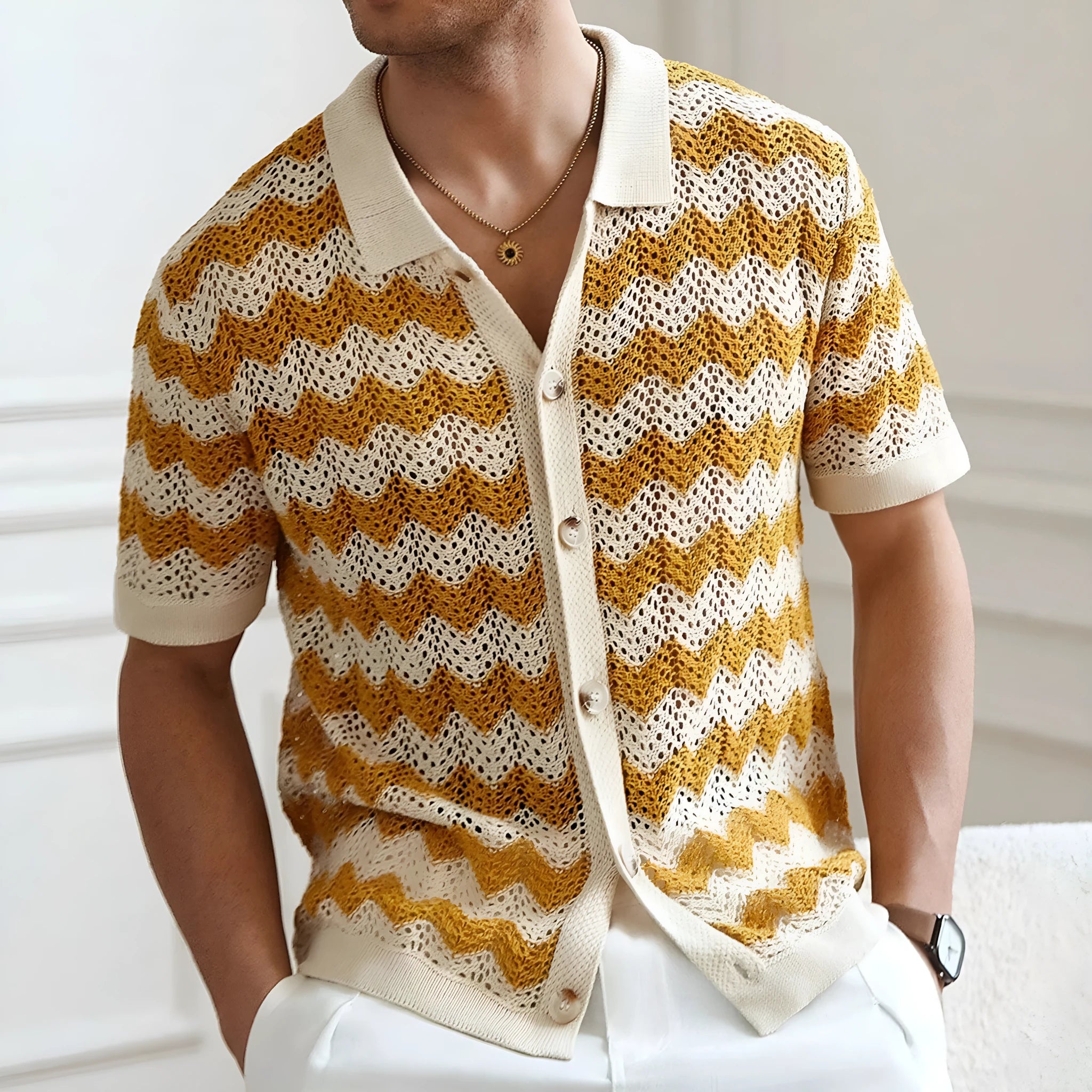 Man modelling a yellow short sleeve sweater with a textured corrugated jacquard pattern, suitable for summer.