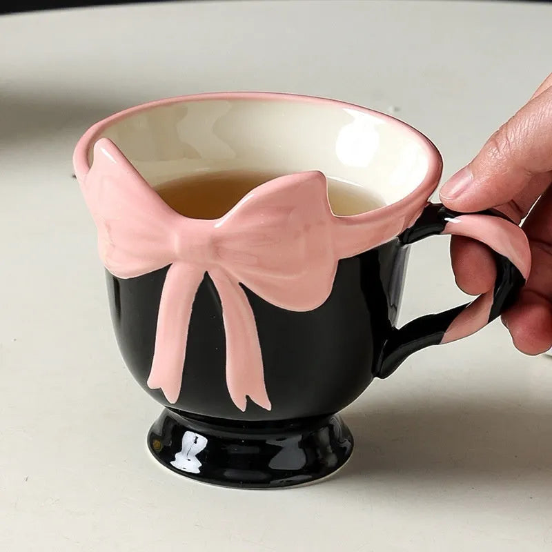 Ceramic heart bow mug with handle in white powder or black pink colour, 330ml capacity