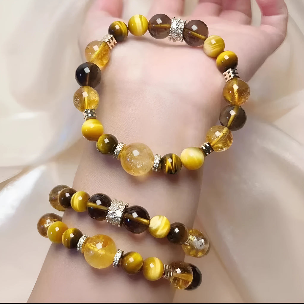 Yellow artificial crystal bracelet with 10mm Jinba large beads on a string.