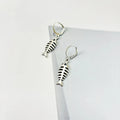 Women's retro-style alloy fishbone pendant necklace and matching earrings set on a white background