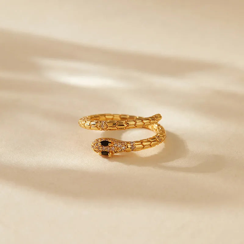 Snake-shaped adjustable index finger ring with copper construction and 18K gold colour finish