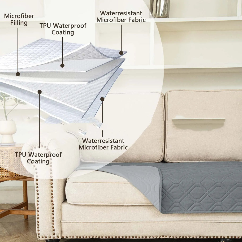 Double-sided waterproof dog sofa cushion showing dark grey and light grey reversible sides on a sofa.