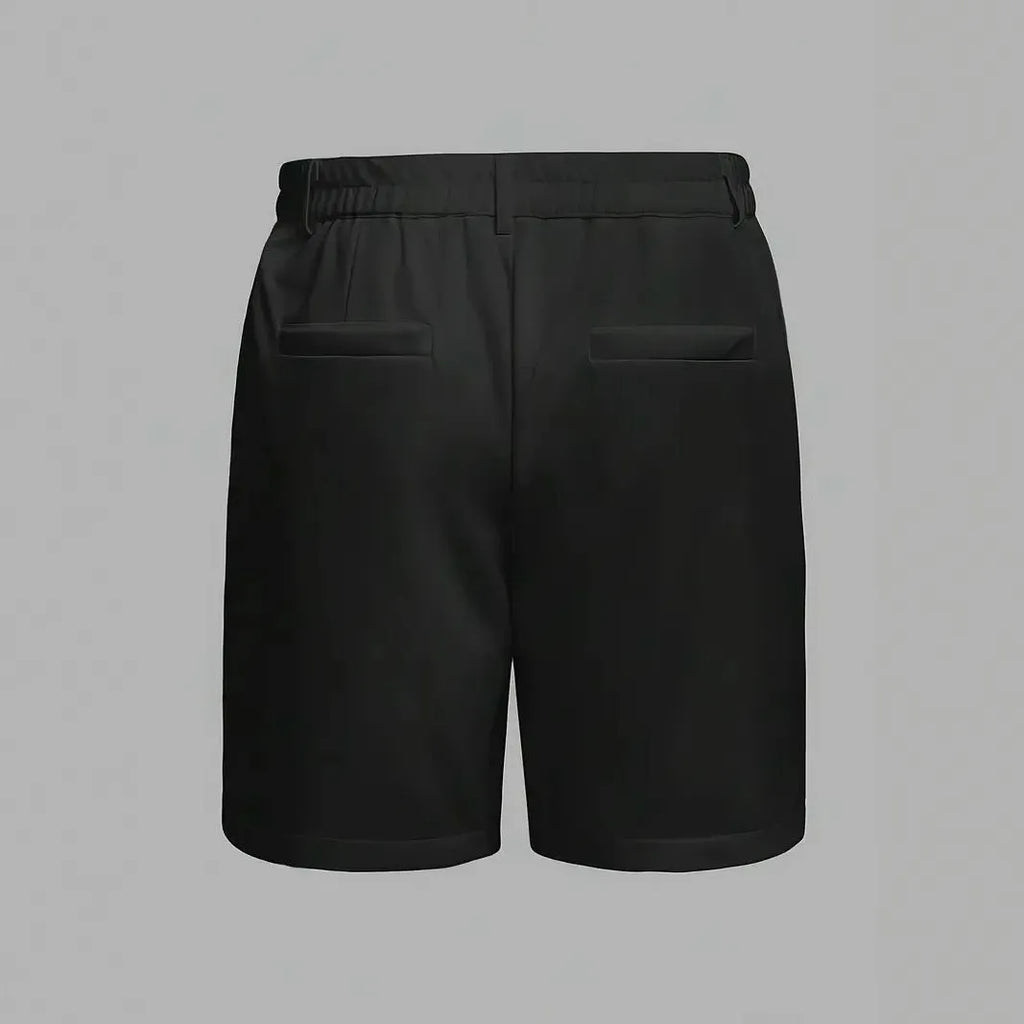Man wearing solid grey cotton blend straight-leg casual shorts with micro-elastic fabric.