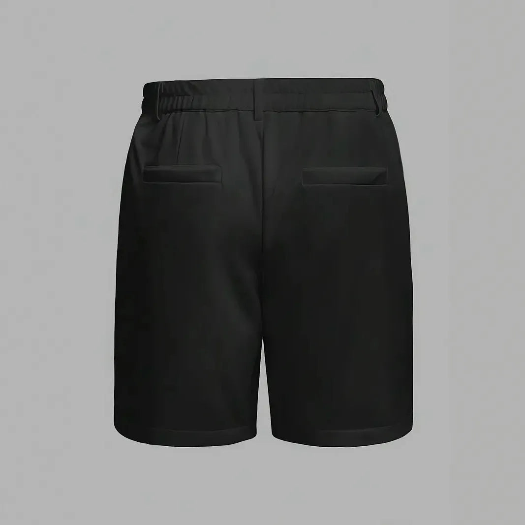 Man wearing solid grey cotton blend straight-leg casual shorts with micro-elastic fabric.