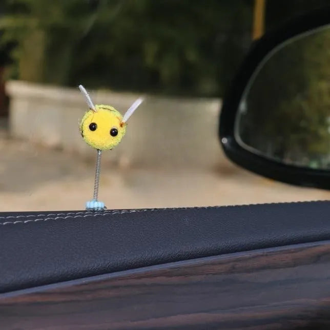 Small furry brown and yellow cartoon bee car decoration ornament measuring 3cm