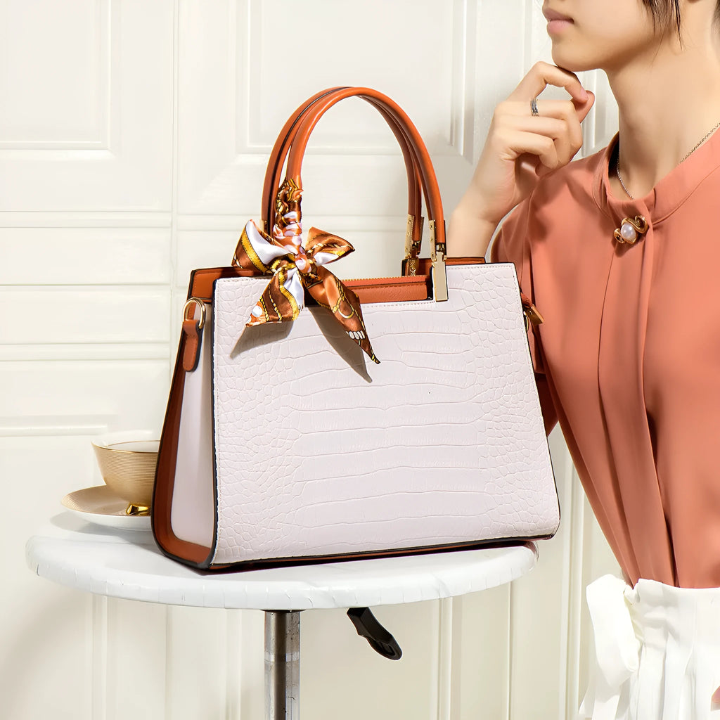 Milky white women's PU leather large-capacity shoulder handbag with internal organisers.