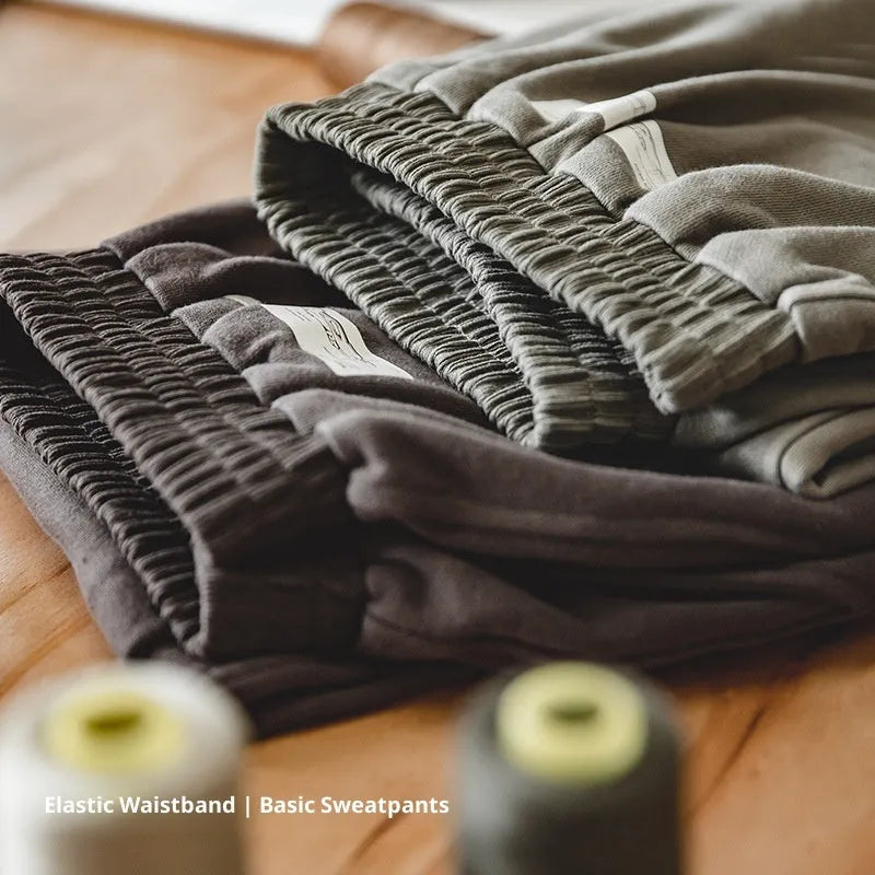 Marden Tooling retro tapered cotton sweatpants in olive green, straight leg with 3D cutting hemming