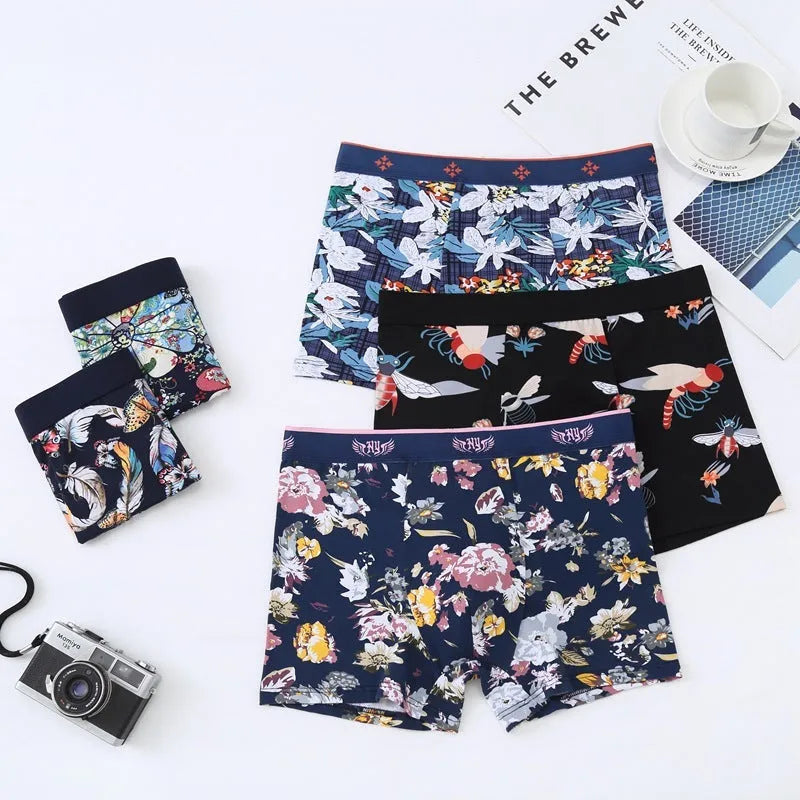 Men's cotton boxer shorts in a floral print, showing the mid-waist fit and U-shaped design.
