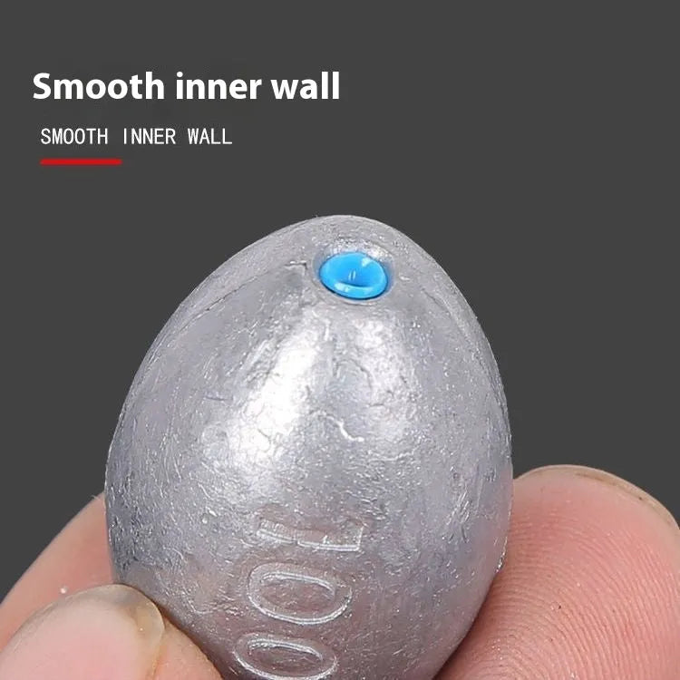 Rugby-shaped olive lead fishing sinker with textured Tongxin scale pattern, shown alongside weight options from 10g to 150g.
