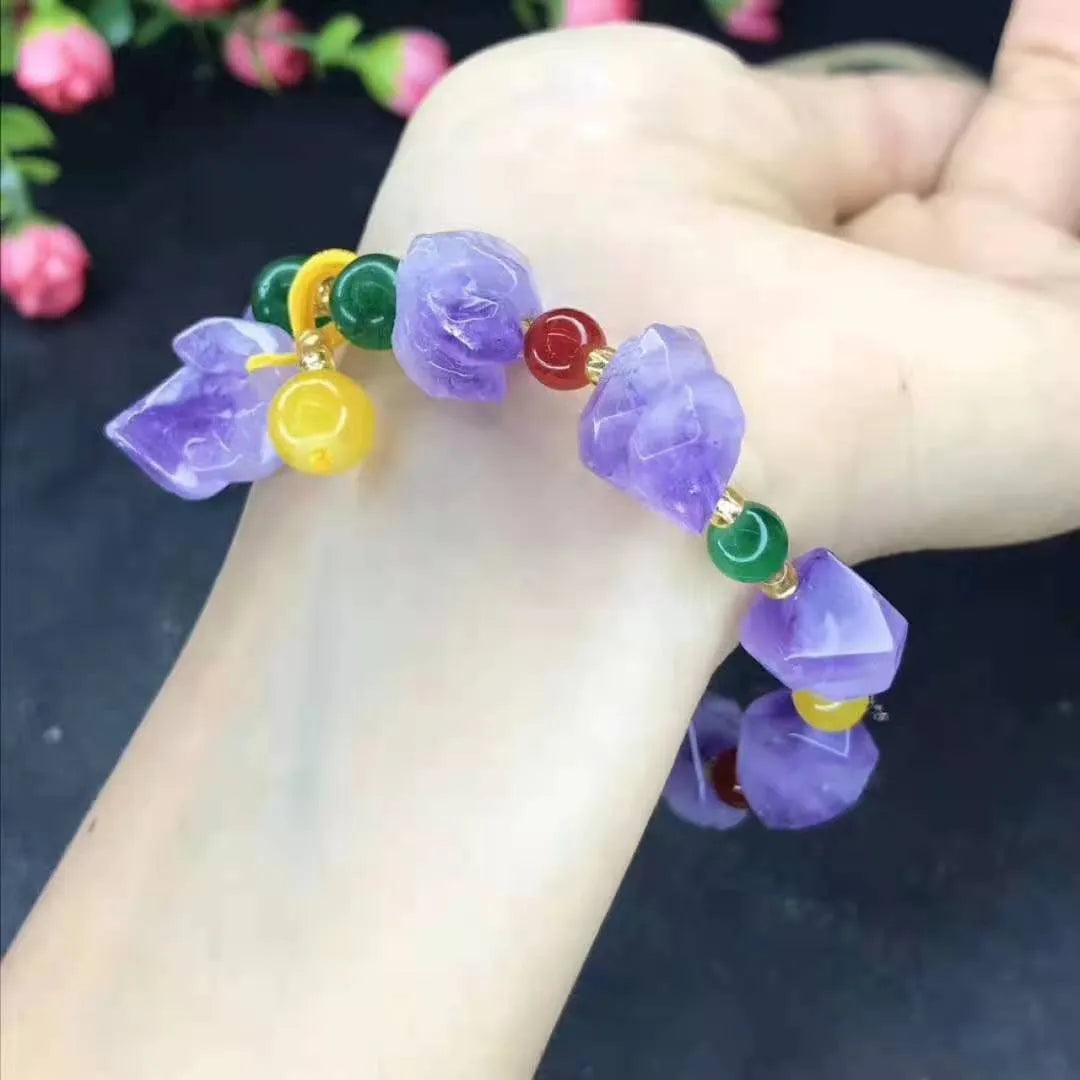 Natural shaped amethyst bead bracelet with a fu character charm on a white background