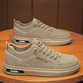 Men's khaki low-top casual shoes with a waterproof PU upper and textured rubber sole.