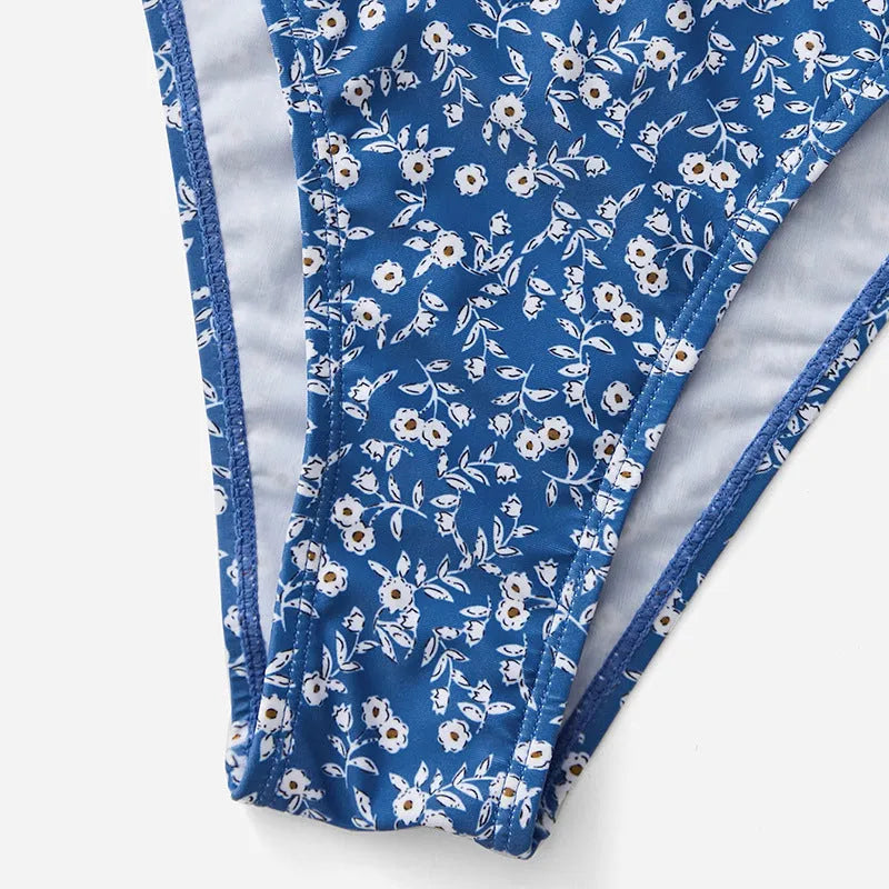 Blue polyester three-piece swimsuit set without underwire, showing separate top and shorts
