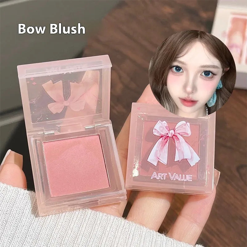 Butterfly Box pink makeup set with four matte lip muds, powder blusher and matching necklace
