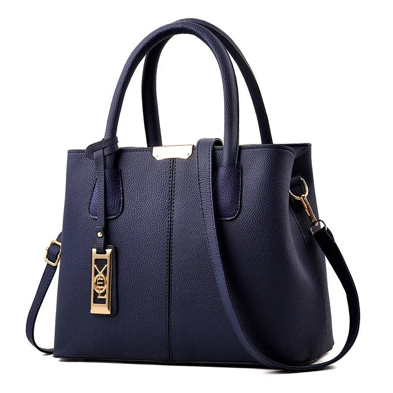 Women's square shoulder bag in soft PU leather with leather strap, shown in multiple colour options