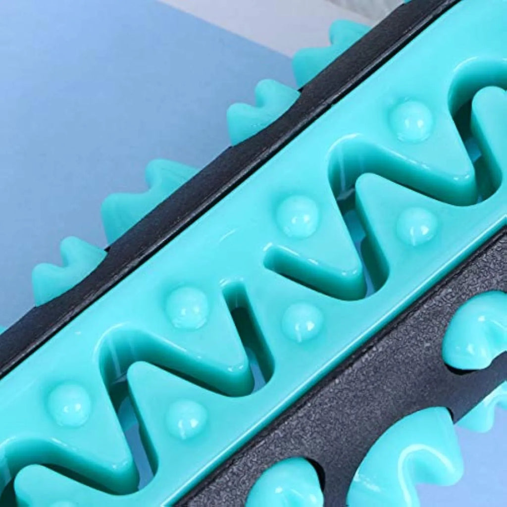 Natural rubber dog toothbrush chew toy in one of four colours, measuring 15cm long