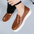 Men's round toe casual PU leather slip-on shoes in white, black and white, and khaki colours.