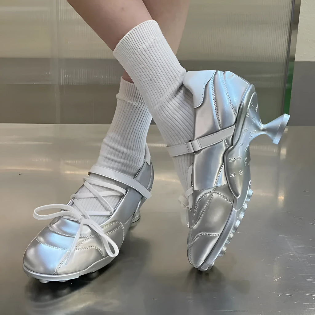 Women's silver lace-up bow sports shoes with a round toe and mid heel on a white background