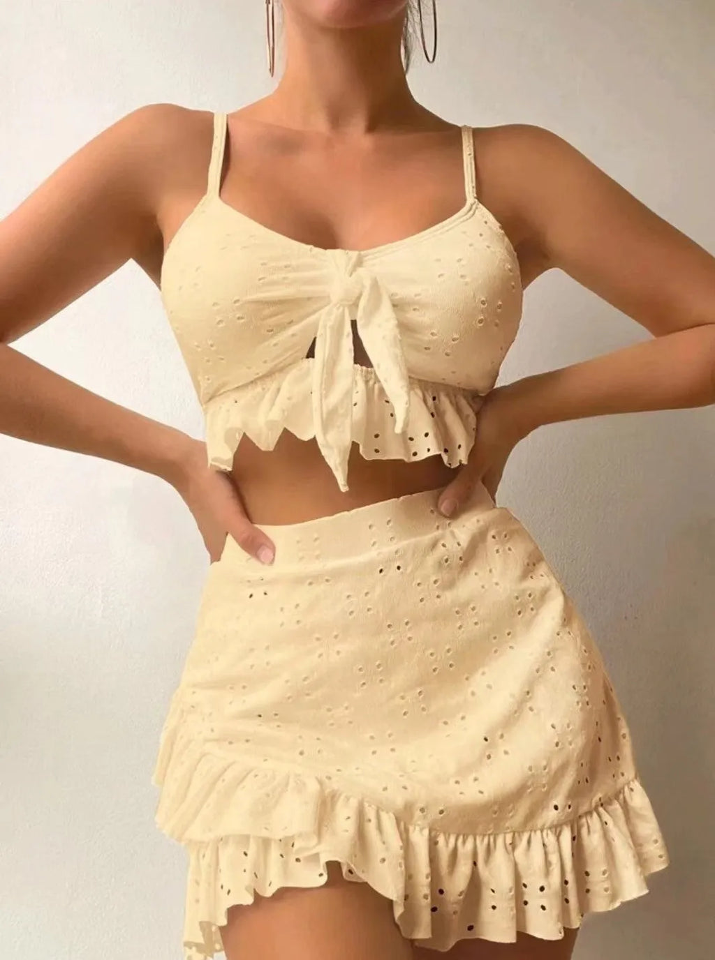 Women's three-piece bikini swimsuit with split hip skirt in solid colour