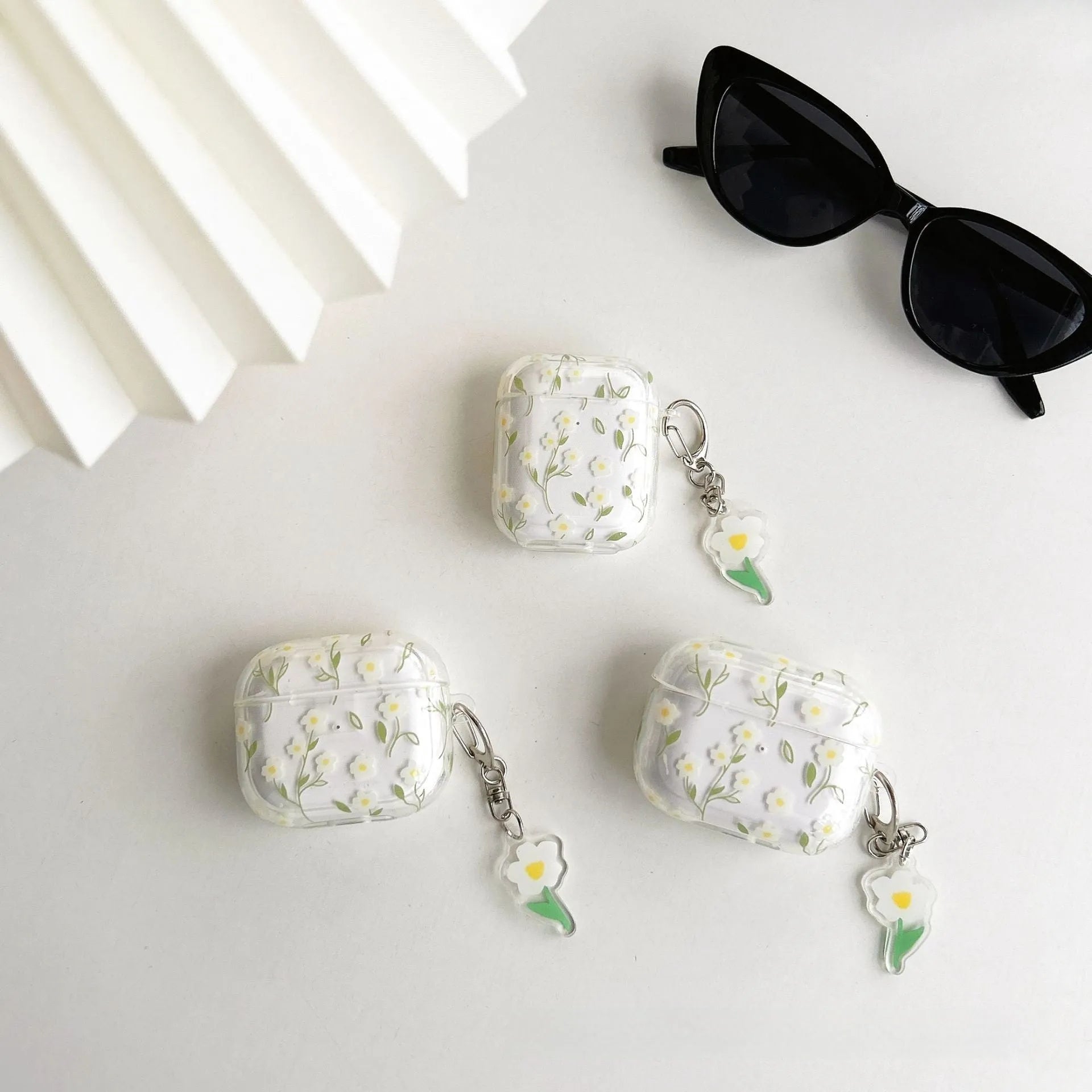 White floral pattern on a transparent TPU protective case for Apple AirPods
