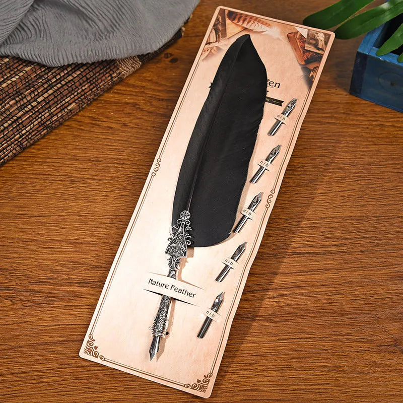 Vintage feather dip pen in multiple colours with zinc alloy construction measuring 30 cm length