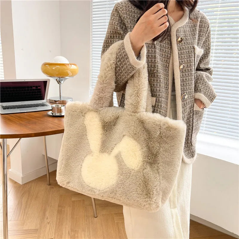 Cartoon rabbit ears design on a solid colour plush tote bag for women.