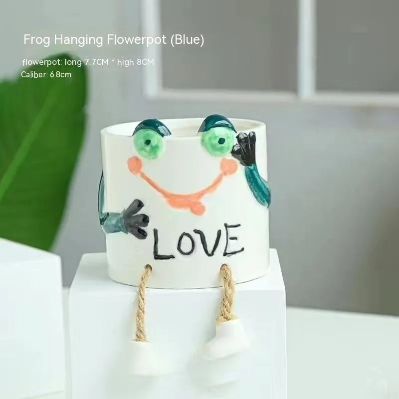 Ceramic hanging foot flowerpot in cartoon style for succulent plants on desktop