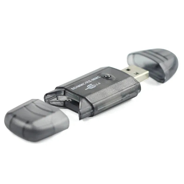 Transparent plastic USB card reader with LED illumination on a desk.