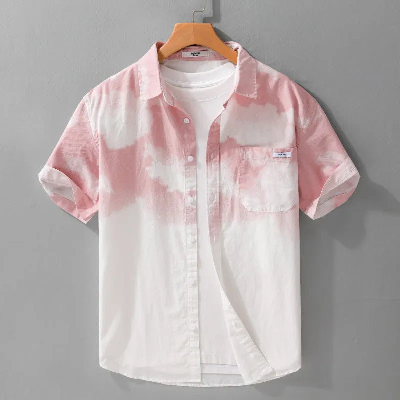 Man wearing a light pink loose-fitting pure cotton short-sleeved cardigan-style shirt.