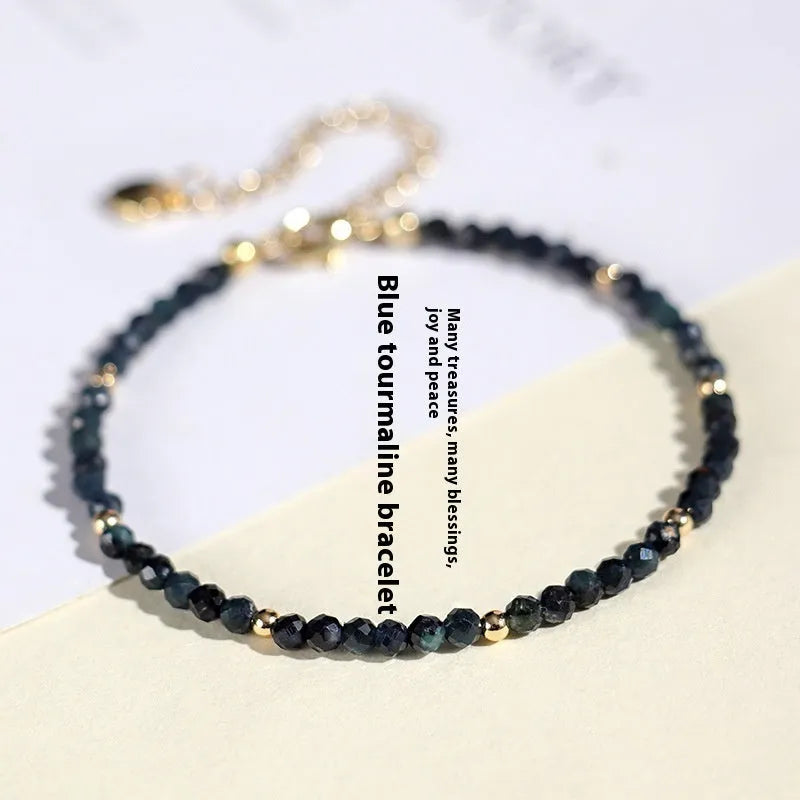 Close-up of a blue tourmaline and spacer bead bracelet for women.