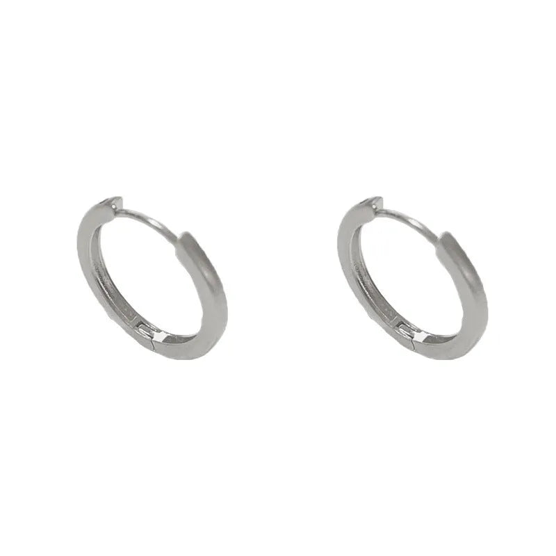 Women's geometric ear clip with round eyelet design in gold plating on copper