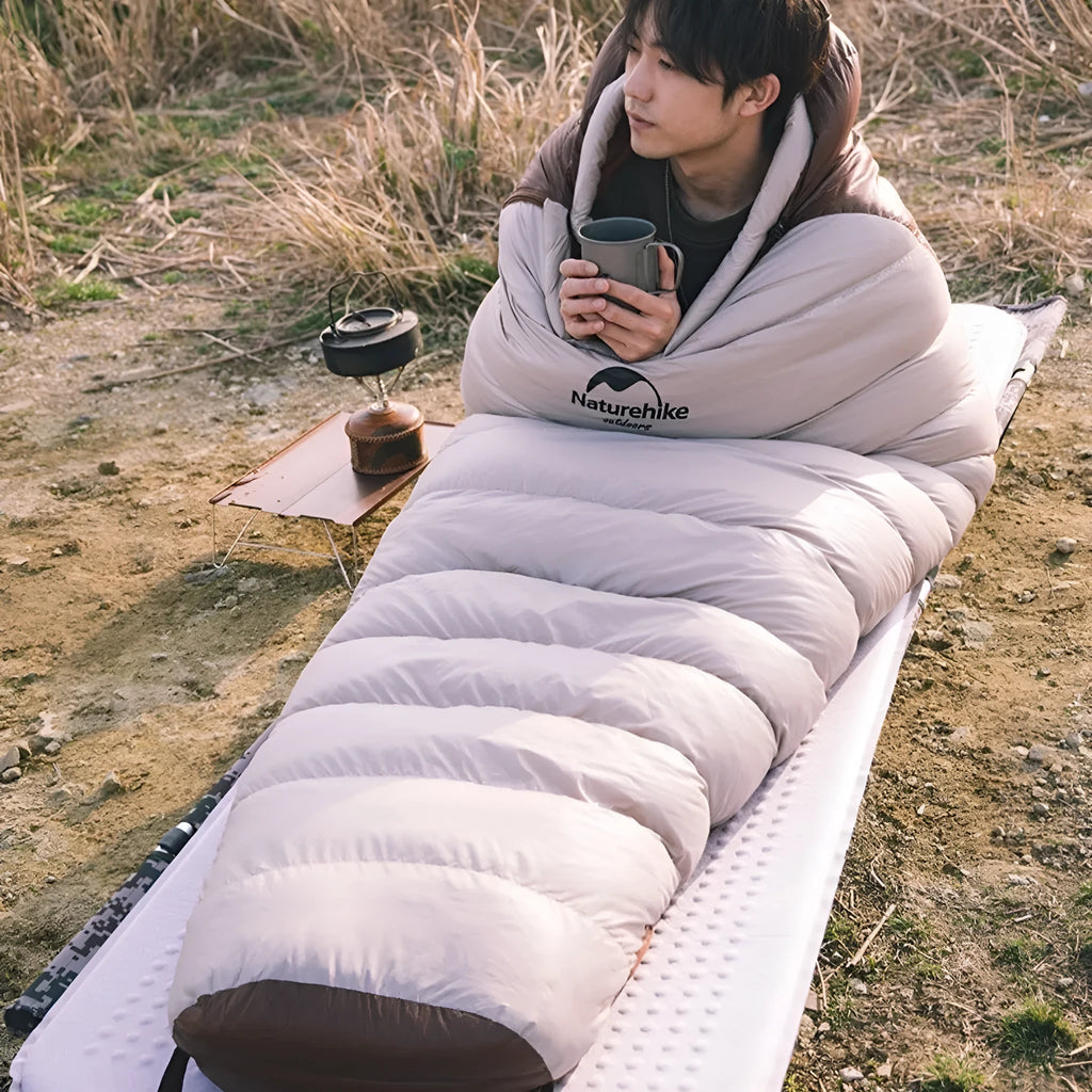 Mummy style goose down sleeping bag with storage bag, shown in snowbird series colour
